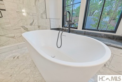 Perched within the gated enclave of Chinquapin, this stunning - photo 36
