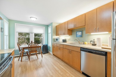 Experience the tranquility of an end-unit condominium, where - photo 11