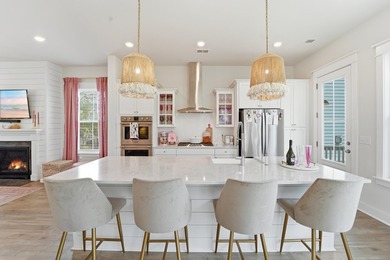 Welcome to this stunning elevated marsh front home on The Island - photo 25
