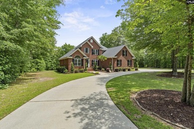 An all-brick home deserves a setting to match, and this property - photo 2