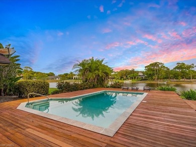 Set behind a curtain of mature landscaping and shimmering water - photo 11