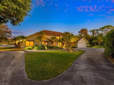 Set behind a curtain of mature landscaping and shimmering water - photo 14