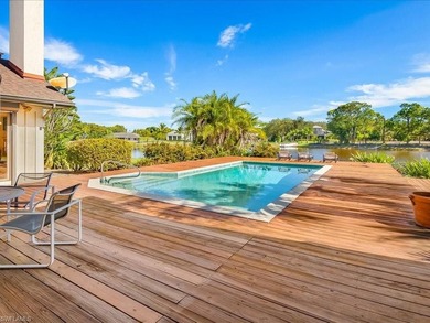 Set behind a curtain of mature landscaping and shimmering water - photo 19
