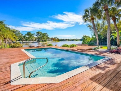 Set behind a curtain of mature landscaping and shimmering water - photo 20
