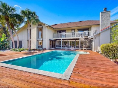 Set behind a curtain of mature landscaping and shimmering water - photo 22