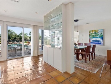 Set behind a curtain of mature landscaping and shimmering water - photo 25