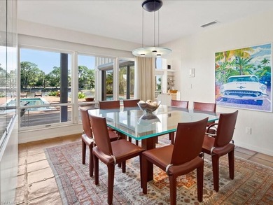 Set behind a curtain of mature landscaping and shimmering water - photo 26