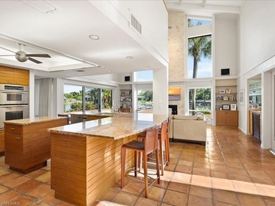 Set behind a curtain of mature landscaping and shimmering water - photo 29