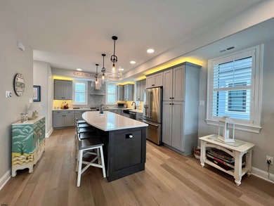 Welcome to this stunning Dean Adams-built beach block 5-bedroom