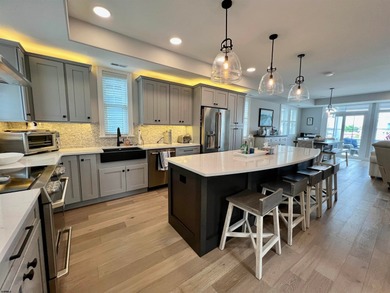 Welcome to this stunning Dean Adams-built beach block 5-bedroom