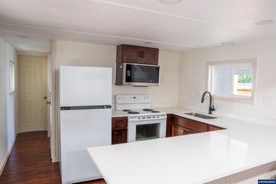 Welcome to Portland! This beautifully updated manufactured home