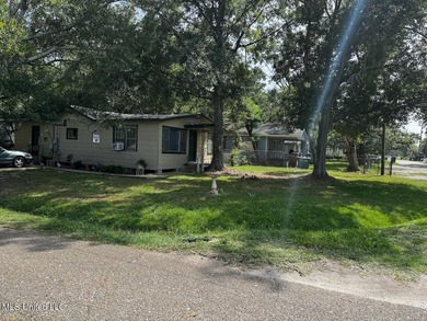 Nestled under beautiful tress located on a corner lot in the - photo 2