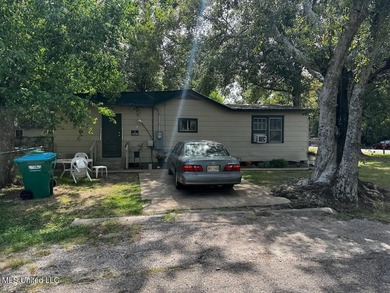 Nestled under beautiful tress located on a corner lot in the - photo 3