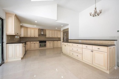 Welcome to this sprawling sunlit ranch with vaulted ceilings and - photo 11