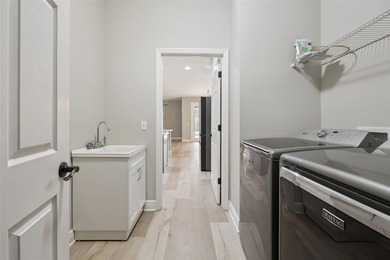 This exceptional home features a thoughtfully designed tri-split - photo 40