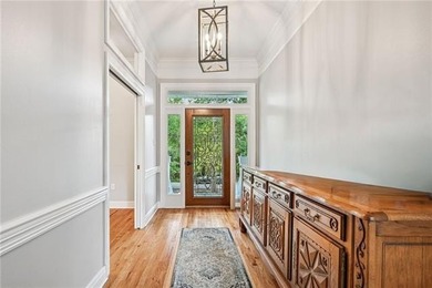 Charming and beautifully updated, this Old Mandeville gem is