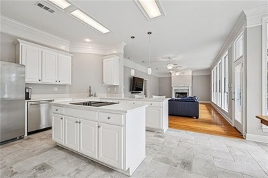 Charming and beautifully updated, this Old Mandeville gem is