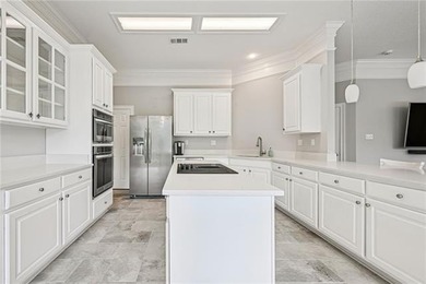 Charming and beautifully updated, this Old Mandeville gem is