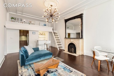 *Welcome to this charming 25 ft wide townhouse co-op with an - photo 2