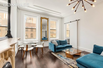 *Welcome to this charming 25 ft wide townhouse co-op with an - photo 3