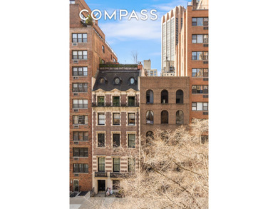 *Welcome to this charming 25 ft wide townhouse co-op with an - photo 5
