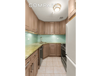 *Welcome to this charming 25 ft wide townhouse co-op with an - photo 8