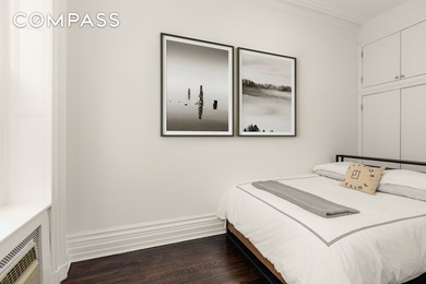 *Welcome to this charming 25 ft wide townhouse co-op with an - photo 9