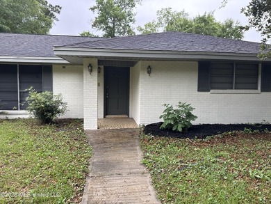 This well-maintained 4-bedroom, 2-bath brick home is situated on - photo 2
