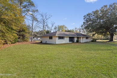 This well-maintained 4-bedroom, 2-bath brick home is situated on - photo 3