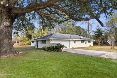 This well-maintained 4-bedroom, 2-bath brick home is situated on - photo 4