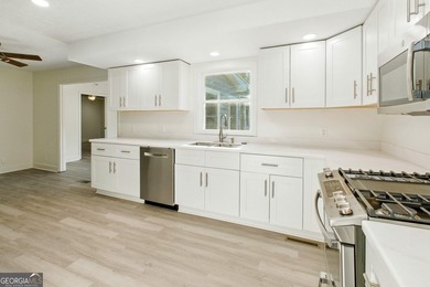 Fully remodeled and move-in ready, this impressive 5-bedroom, 3 - photo 20