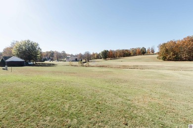 With the backyard facing Benton Golf & Country Club's hole 17