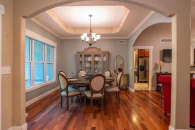 This stunning custom home on over an acre has a beautiful open