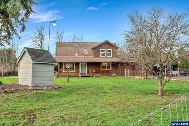 Welcome to this beautifully updated log-style home on 1.5 acres