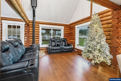 Welcome to this beautifully updated log-style home on 1.5 acres