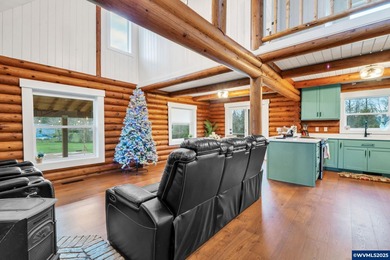 Welcome to this beautifully updated log-style home on 1.5 acres
