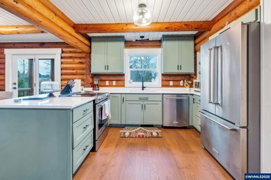 Welcome to this beautifully updated log-style home on 1.5 acres