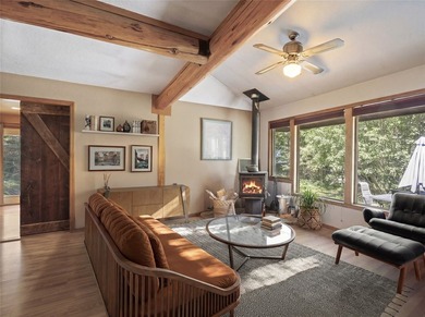 Nestled on a private, wooded .5-acre lot, this chalet-style home - photo 13