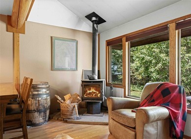Nestled on a private, wooded .5-acre lot, this chalet-style home - photo 15