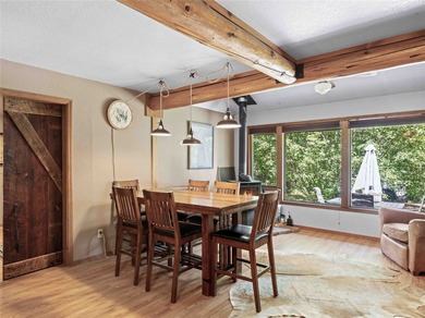 Nestled on a private, wooded .5-acre lot, this chalet-style home - photo 16