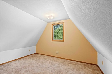 Nestled on a private, wooded .5-acre lot, this chalet-style home - photo 35
