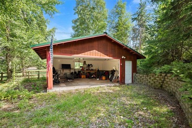 Nestled on a private, wooded .5-acre lot, this chalet-style home - photo 42