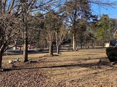 Charming 3-bedroom, 2-bath home situated on a full 1-acre fully - photo 6