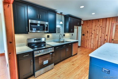 This canal-front home is move in ready and full of character and - photo 13