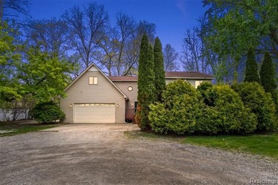 Situated on 1.13 acres with 150 feet of waterfront on the canal - photo 1
