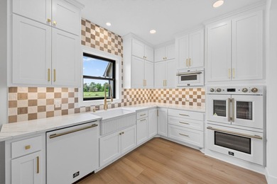 Experience luxury living in this custom-built two-story home by - photo 12