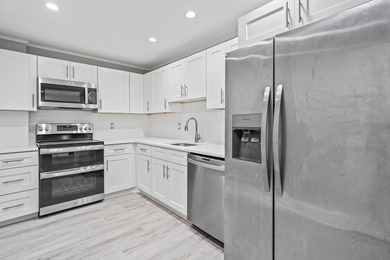 Welcome Home! This beautifully renovated, oversized condo is - photo 5