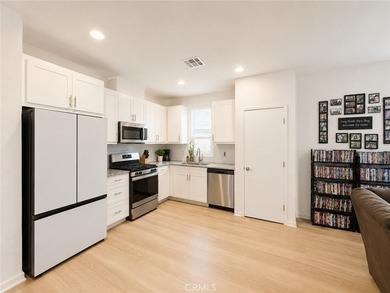 PRICE TO SELL WITH TONS OF UPGRADES! Experience modern living in - photo 2