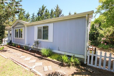 Nestled along the scenic Oregon Coast, this charming 2-bedroom - photo 2