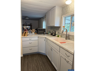 Nicely updated home w/new LVP flooring, metal roof, updated